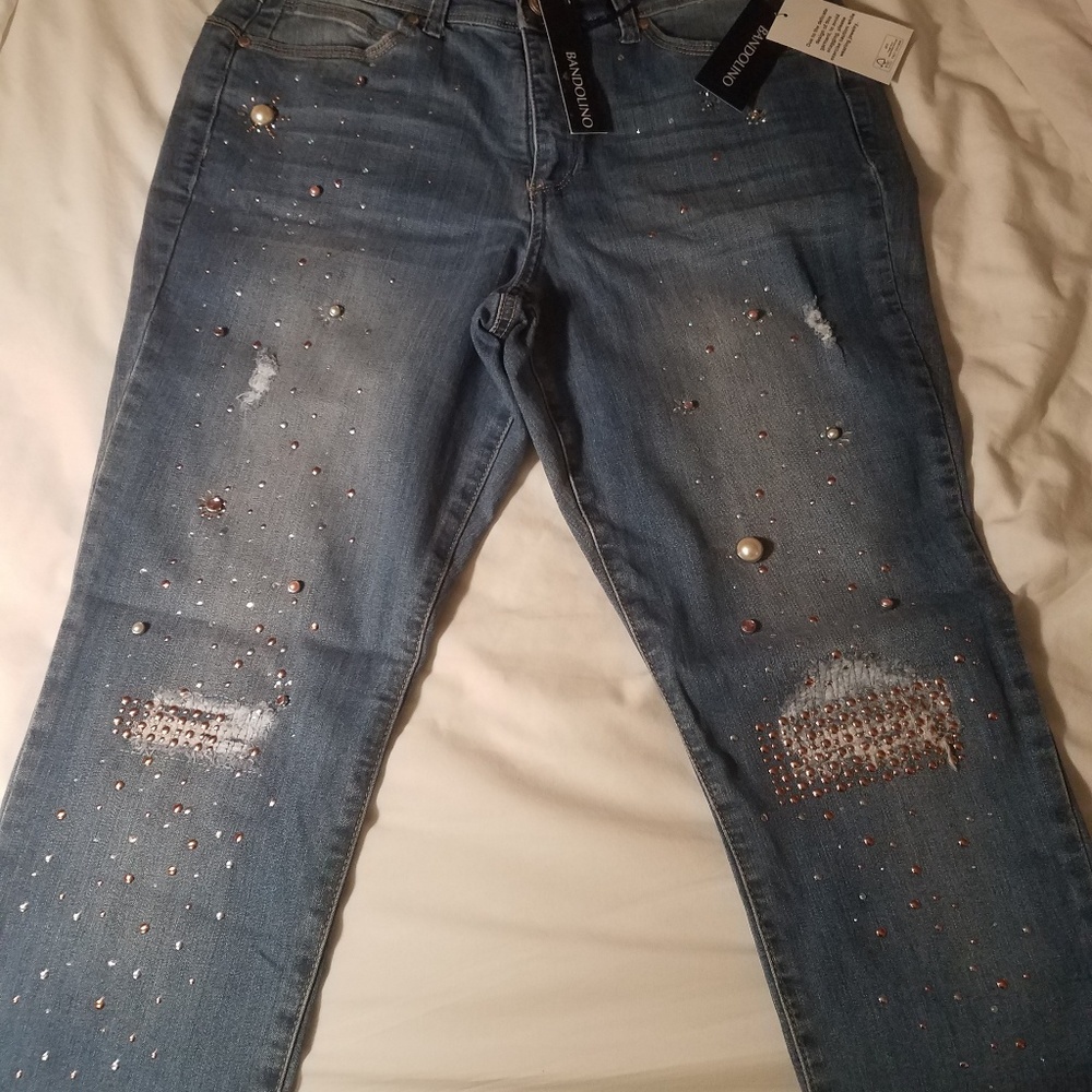 Bandolino jeans with lots of studs on them